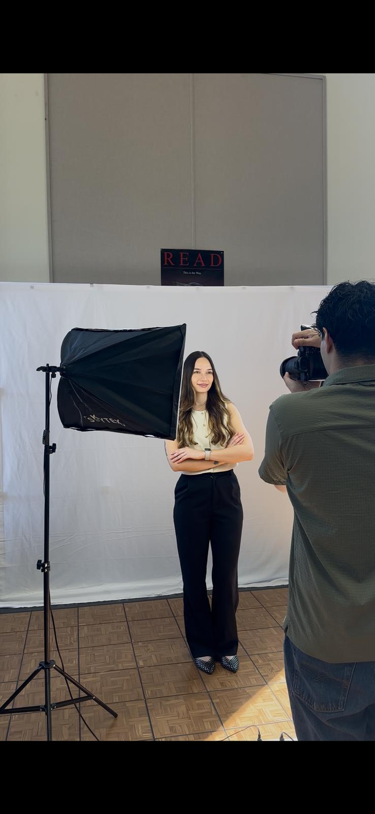 A female student poses for a professional headshot