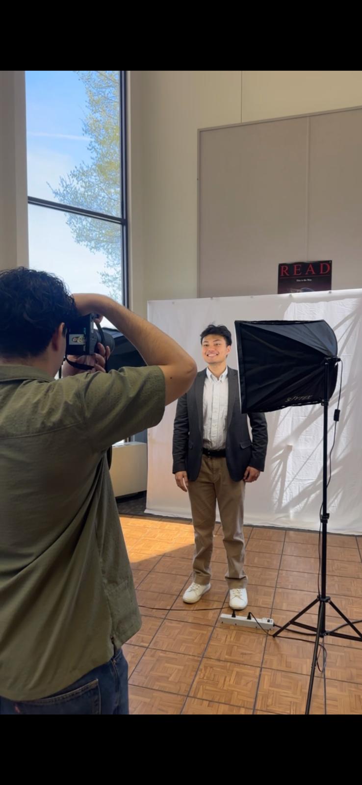 A male student poses for a professional headshot