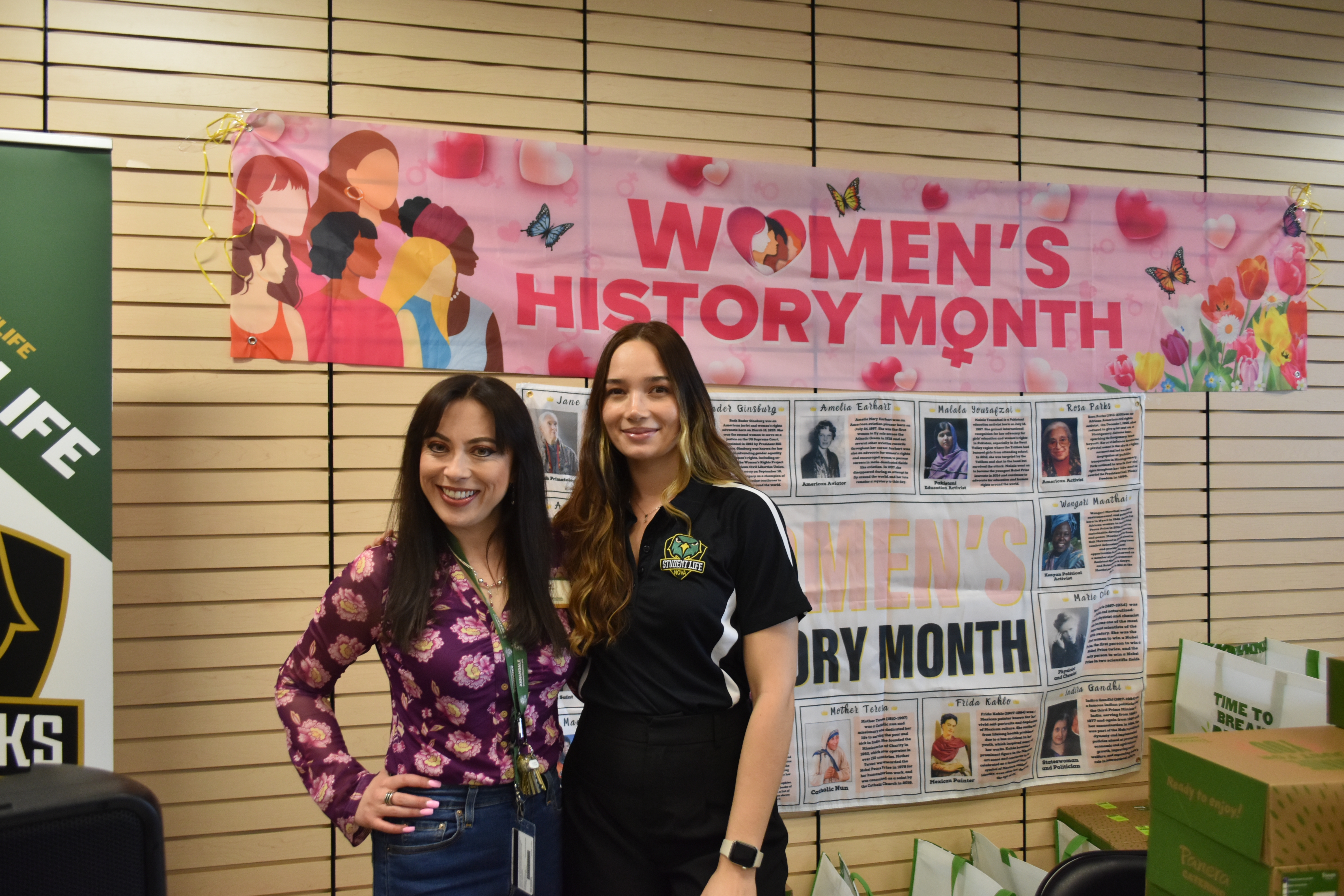 Two female student life representatives taking a photo together