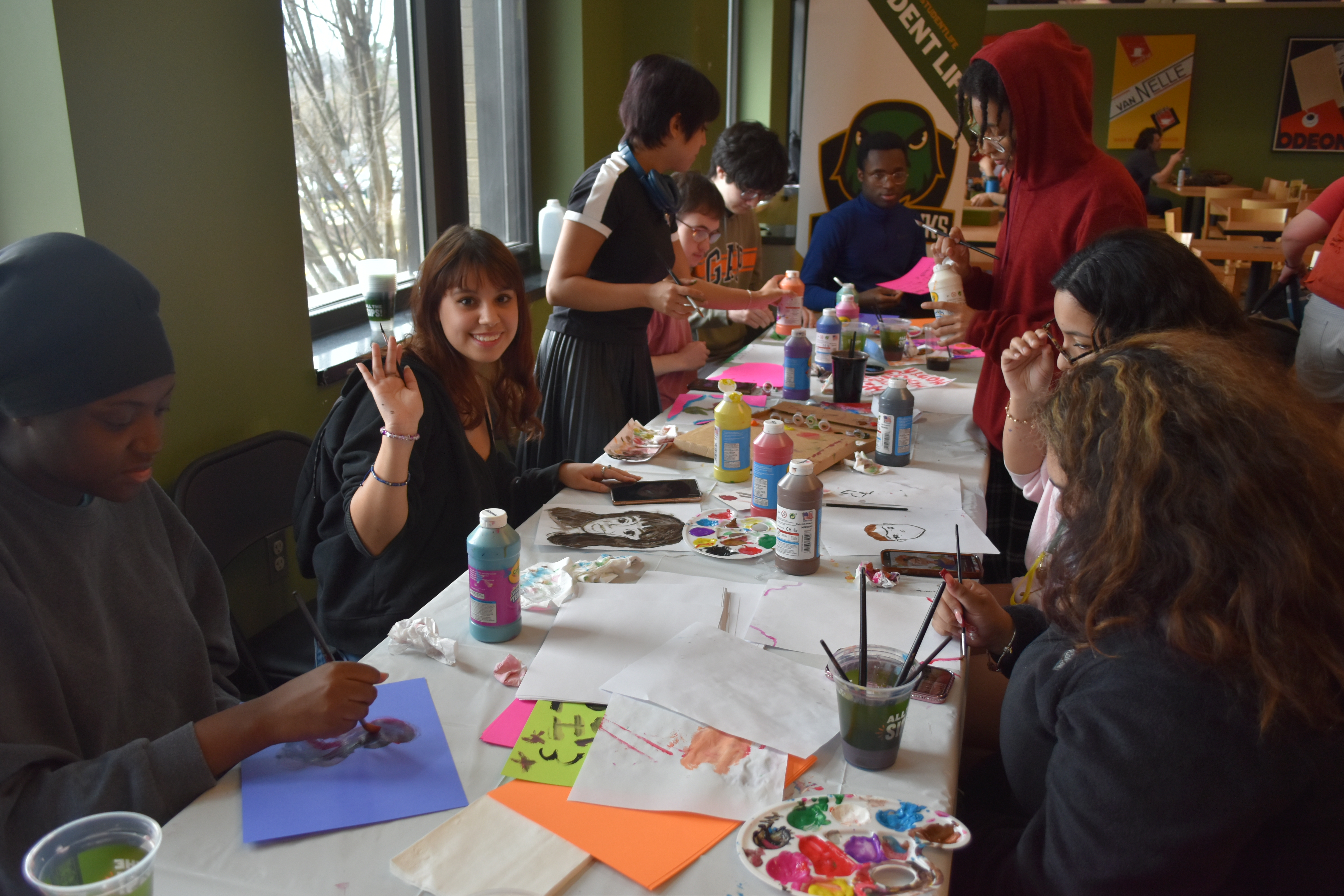 Students painting and enjoying their activity