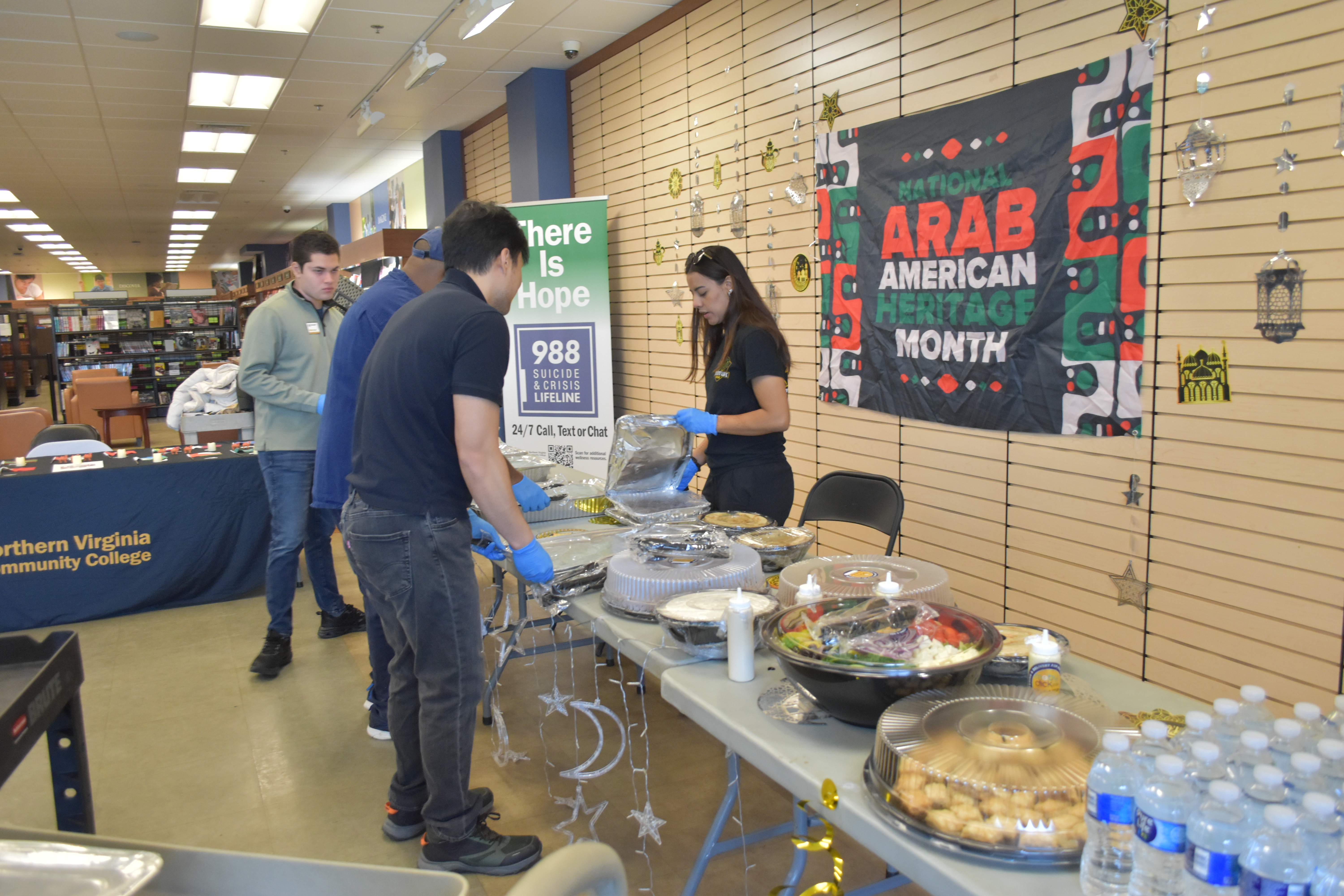 Picture of our decor from the event, featuring an ambassador handing out food.
