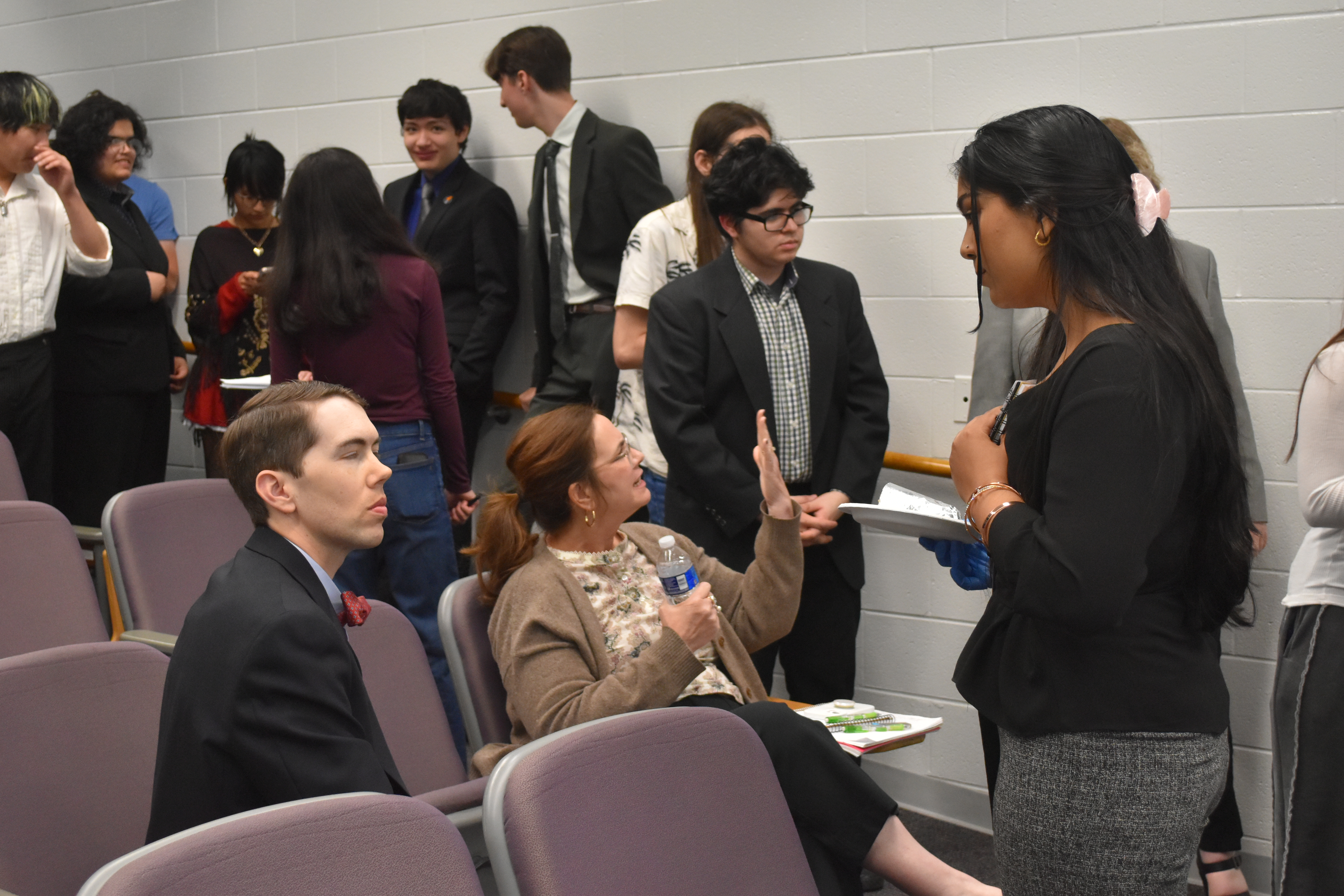 Debate Night judges- Professor Mark Royce and Professor Kerenza Jerbi with Debate Club President and host Junainah Zafar