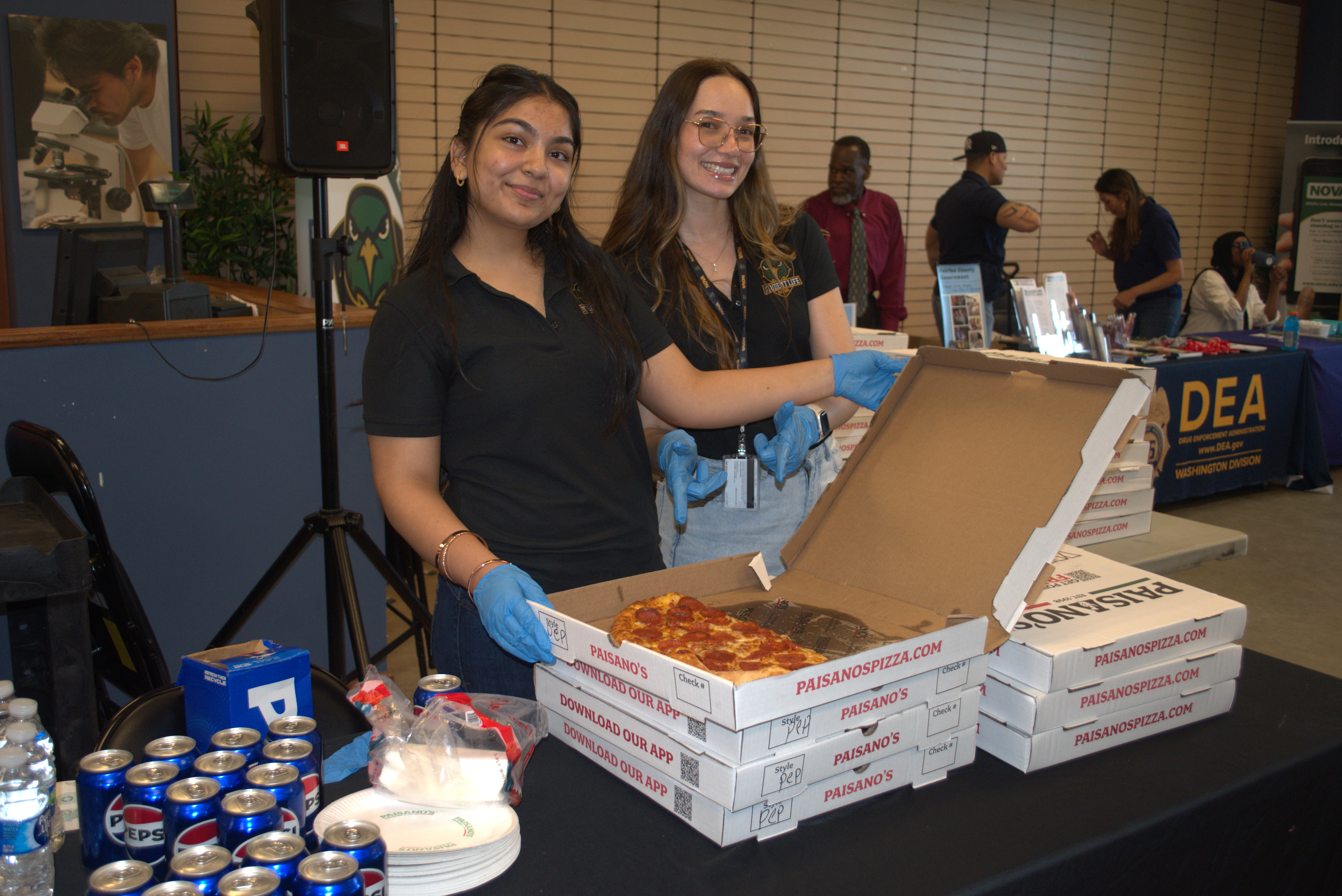 Local health representative serving pizza