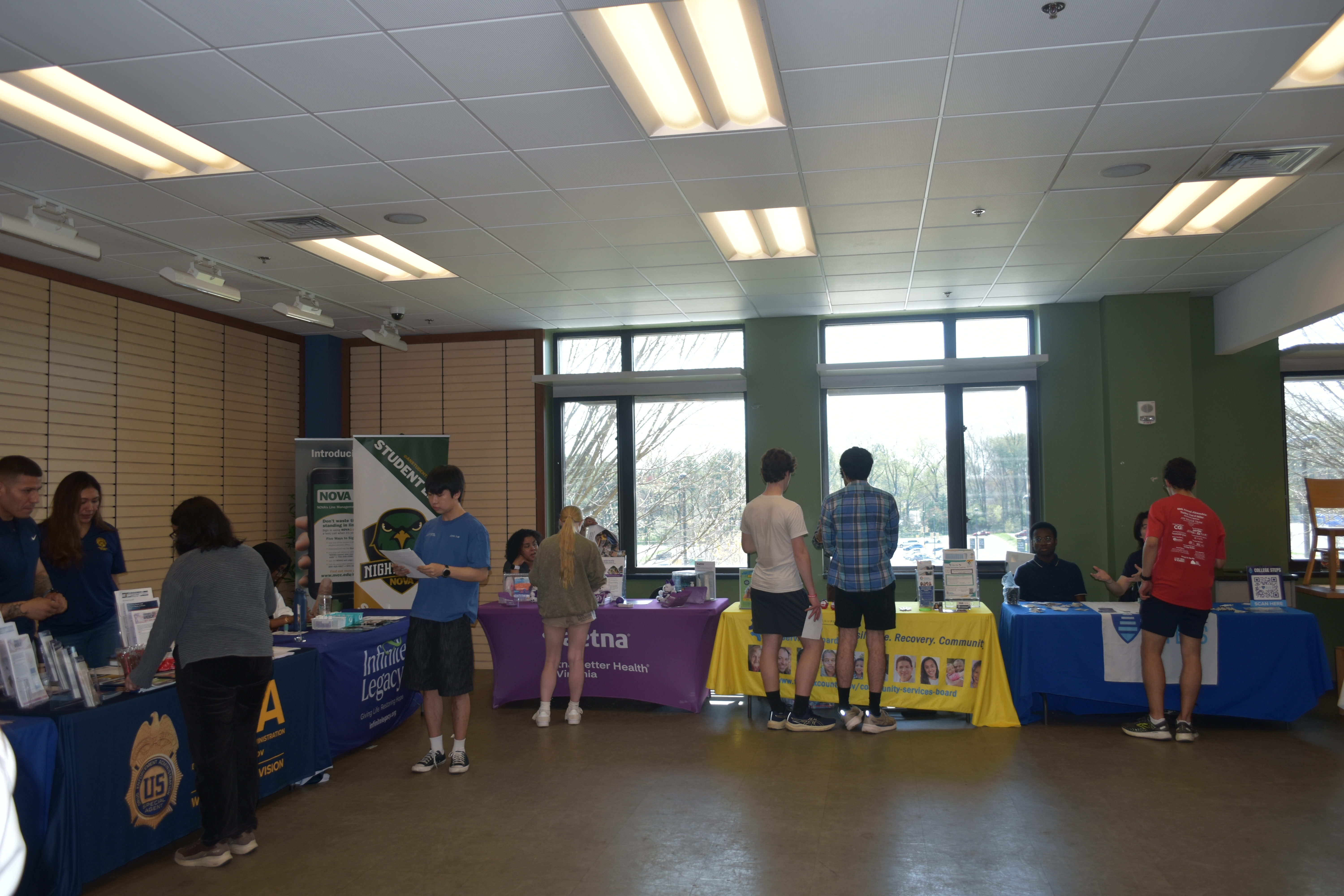 A photo of a local health event with tables and brochures