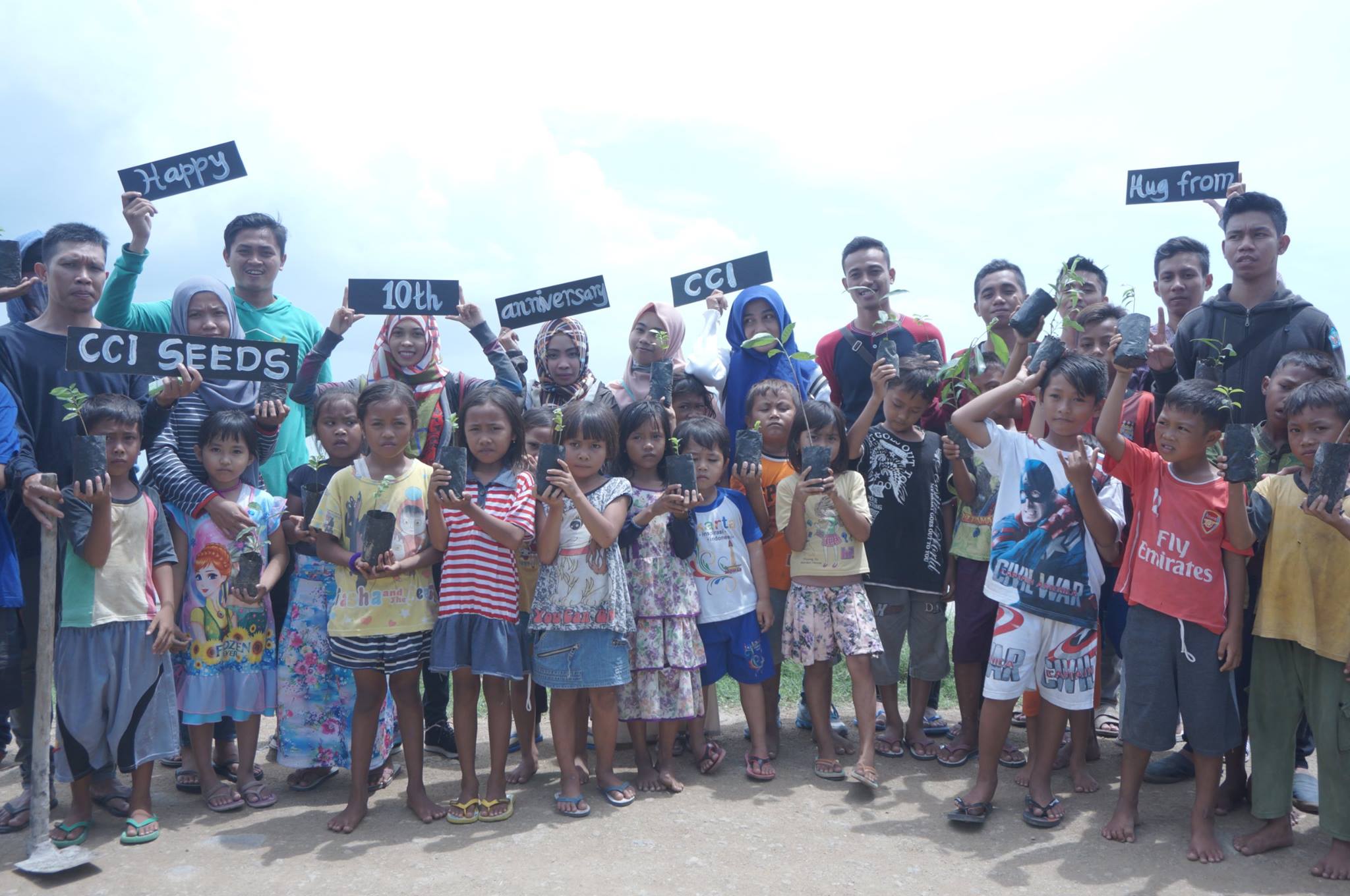 Local children and volunteers celebrate 10 years of the CCI Program in Indonesia.