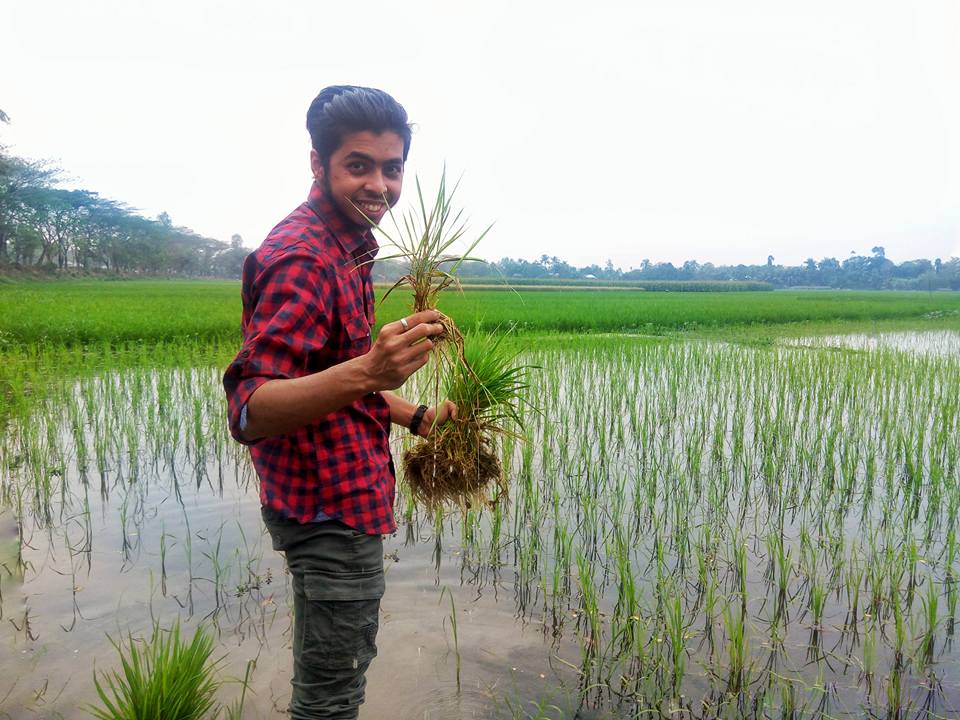 Bangladeshi CCI student Syed Minhaj Hossain plants seedlings