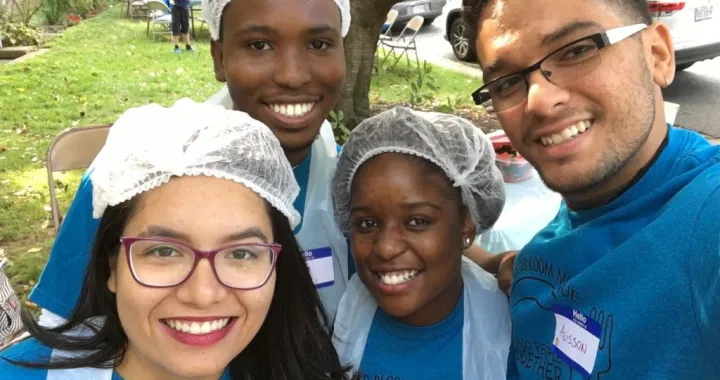 Group photo of four students for International Volunteer Day