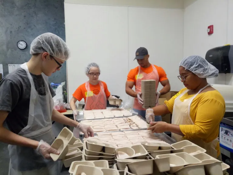 CCI participants at Valencia College volunteering at the Second Harvest Food Bank of Central Florida.