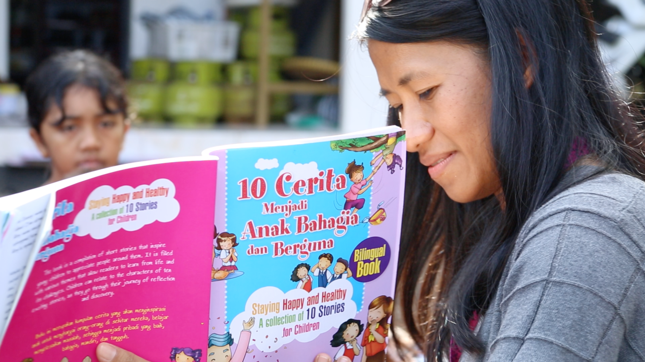Ziadah reads to children in Lombok, Indonesia