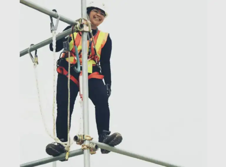 CCI alumna Bunga Yuniasari, who studied public safety at Northeast Wisconsin Technical College, works as an engineer and safety officer for an energy company in Indonesia. When working at heights higher than six feet, she must wear a full body safety harness, which is designed with an active fall arrest system. One of the eight under-construction buildings for which Bunga is currently responsible includes a chimney that reaches 770 feet.