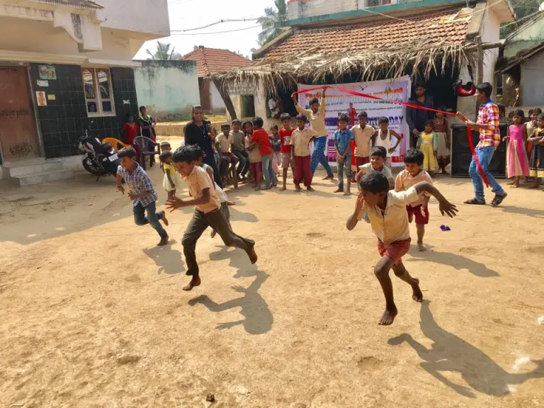 Children run races during CCI alumnus Rajesh’s “Sports Day.”