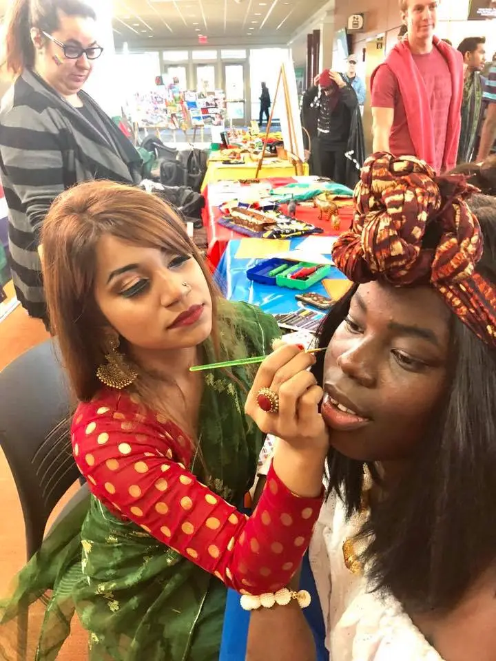 CCI participants at College of DuPage applied henna designs during the college’s Global Education Fair