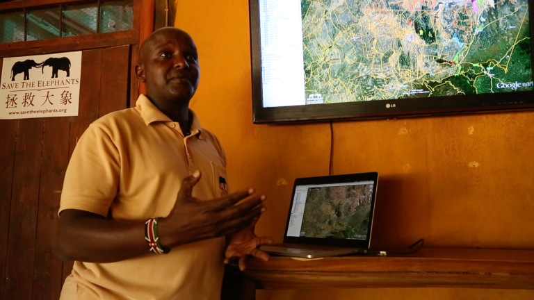 Gilbert explains the GIS technology he uses to track elephants at Samburu National Reserve.