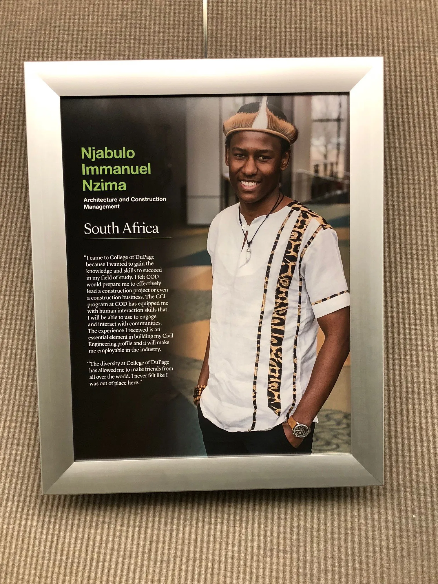 CCI alumnus Njabulo Immanuel Nzima’s portrait and story in the International Hall at College of DuPage.