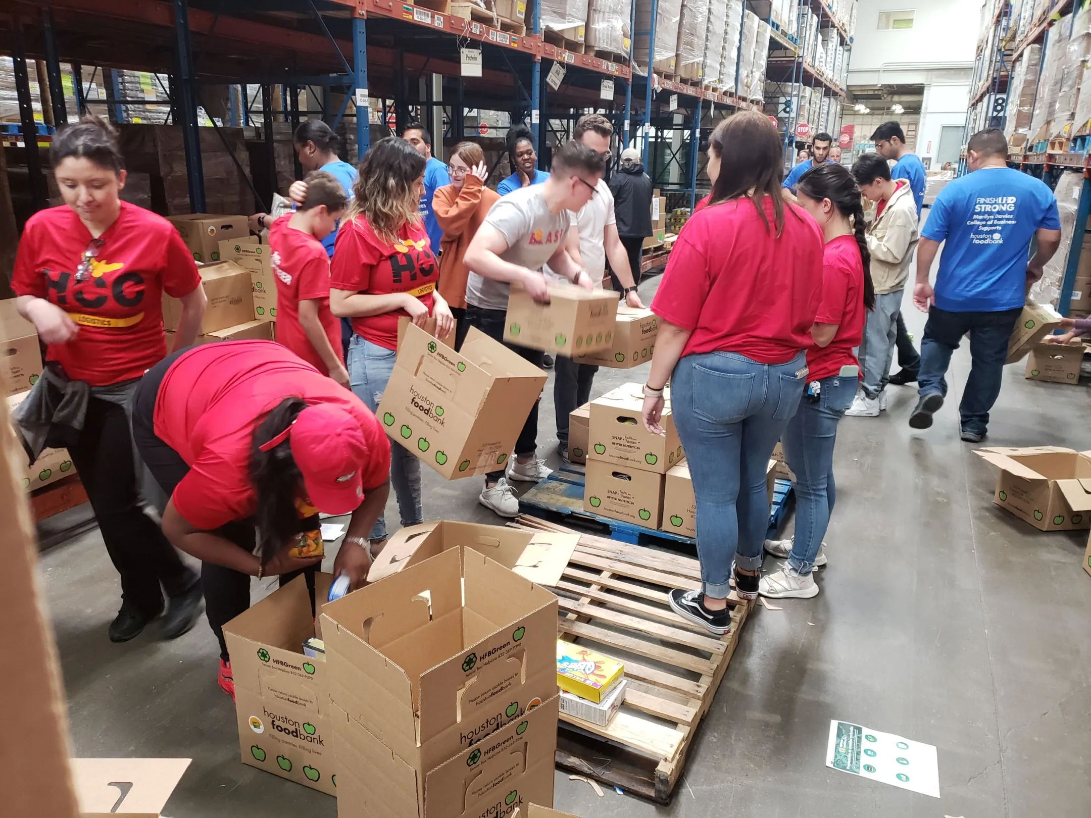 Houston Community College students in the HCC Logistics Student Club learned about logistics management during a visit to the Houston Food Bank’s warehouse. The students also packaged food for the Food Bank to distribute. [Photo courtesy of HCC Logistics Club]