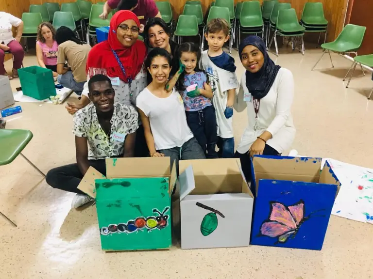 In Cali, Colombia, CCI alumna Jamila Ruiz Paz (far right) invited youth to spend an afternoon painting “eco-boxes” to be used to collect and recycle garbage from the streets.