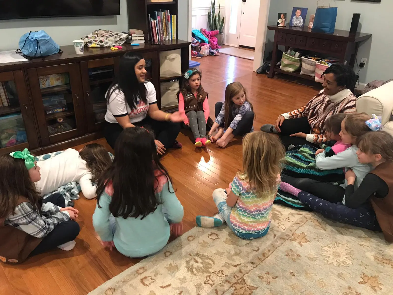 CCI participants Marlin and Sarah lead a group discussion with the Girl Scouts Troop about the Dominican Republic.