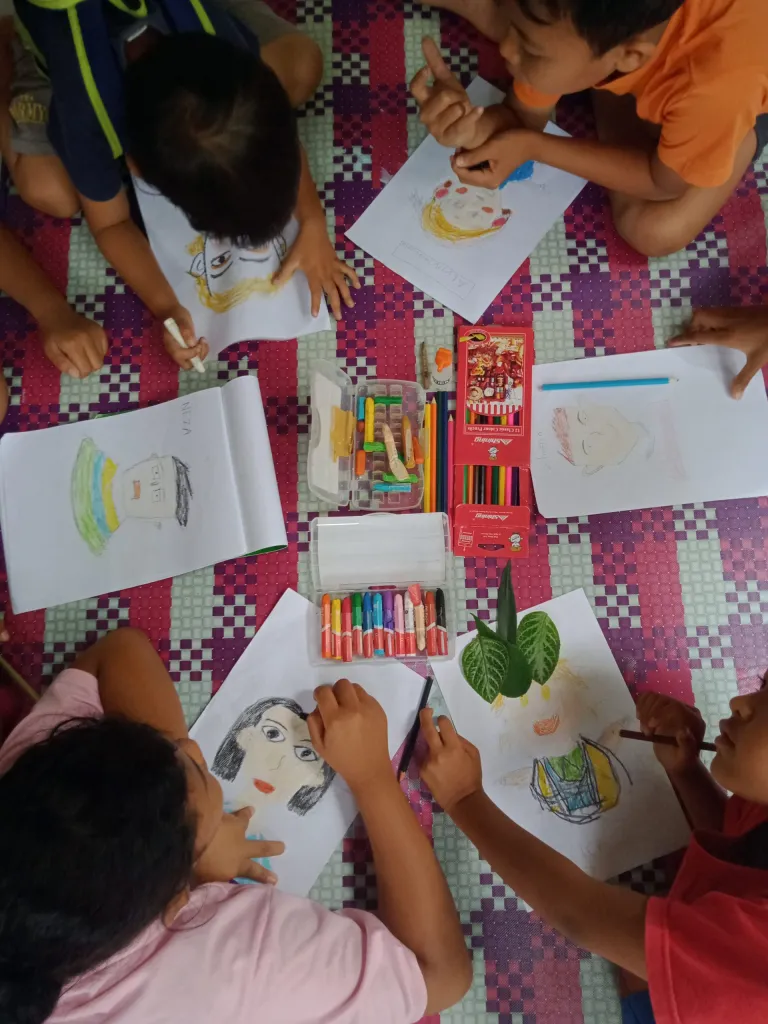 Children participating in a coloring activity as part of their Brave English classes.