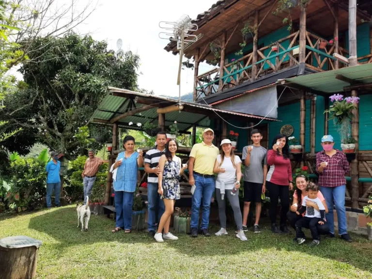Luisa poses with her family on their coffee bean farm in Colombia.