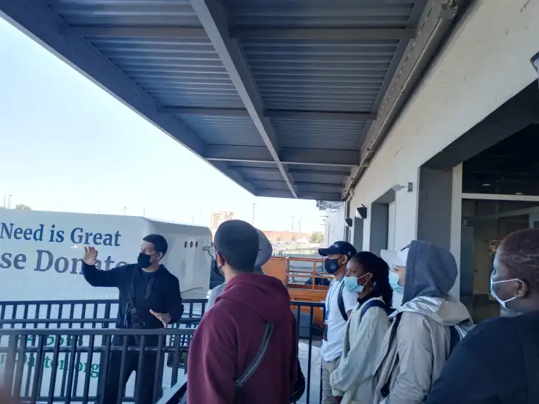 CCI participants at Sinclair Community College receive instructions while volunteering at a local food pantry.