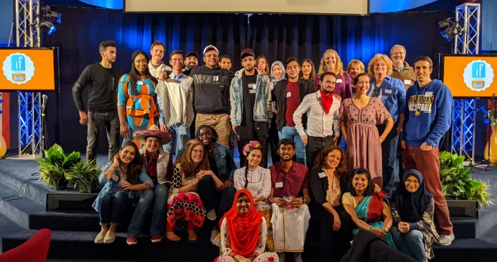 Aswin and Luisa pose alongside the 2019-2020 Northern Virginia Community College cohort of CCI participants during a cultural potluck.