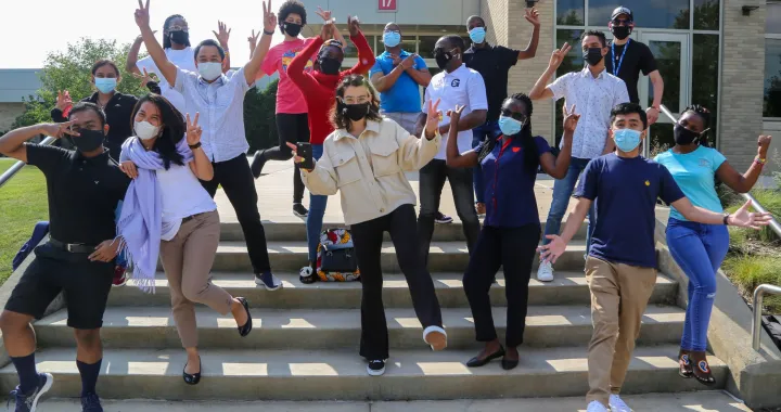 The 2021-22 CCI cohort at Fox Valley Technical College in Wisconsin hands in the air having fun posing.