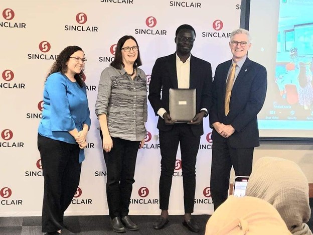 Ibrahim receiving his certificate