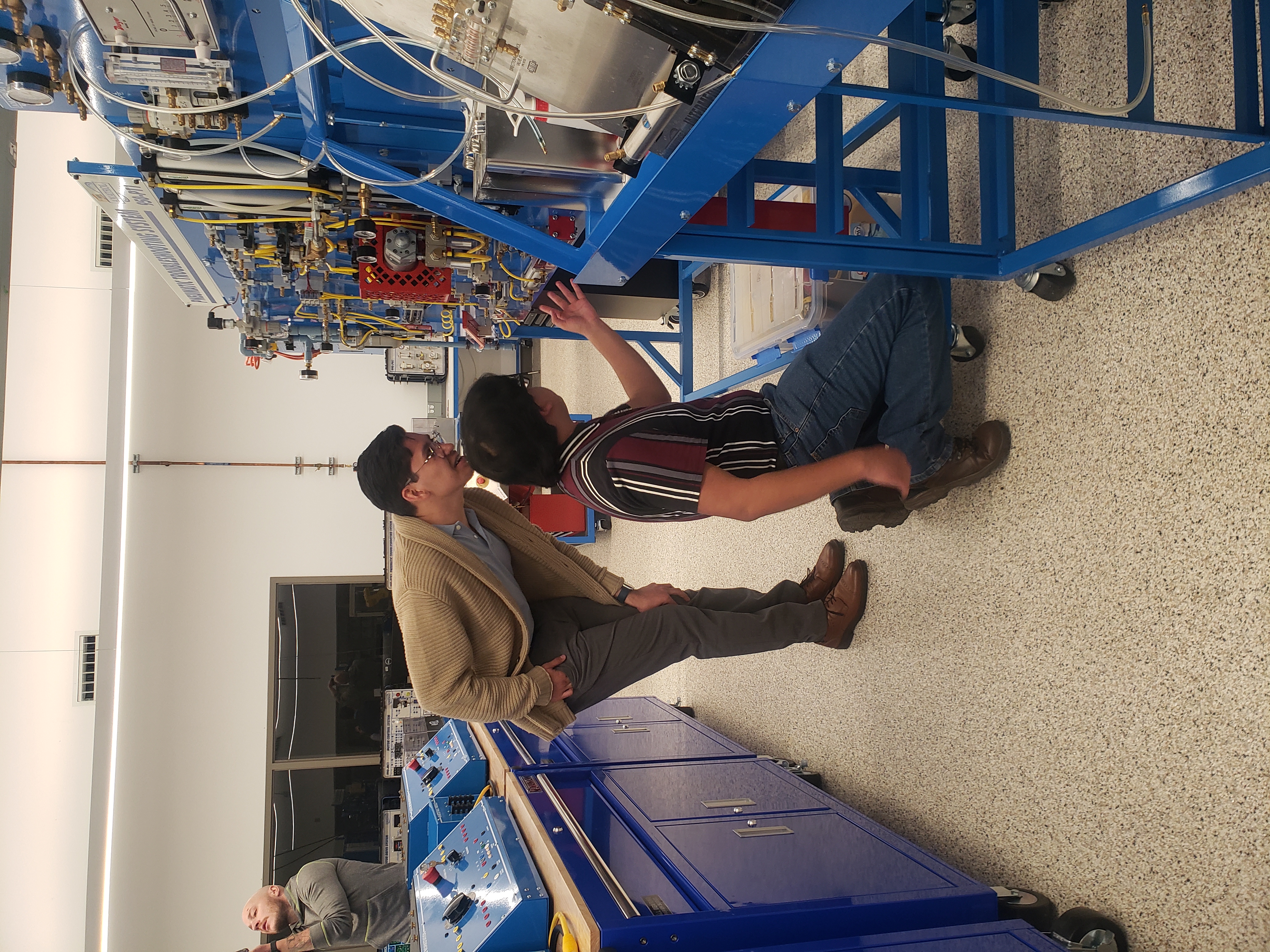 Participants from Mexico work in the lab at MCC
