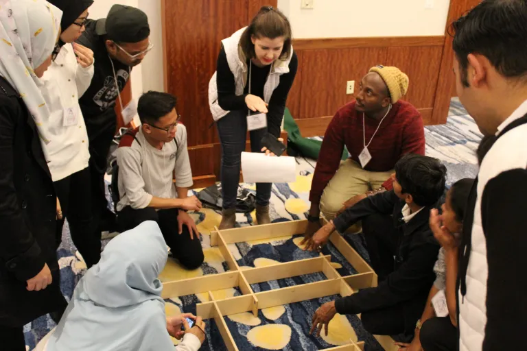 By working through a complex puzzle, CCI participants discovered the importance of effective communication in teams.
