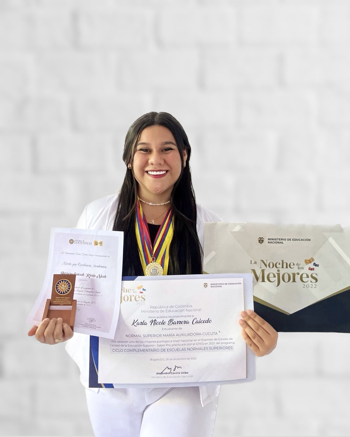 Karla holding her certificate