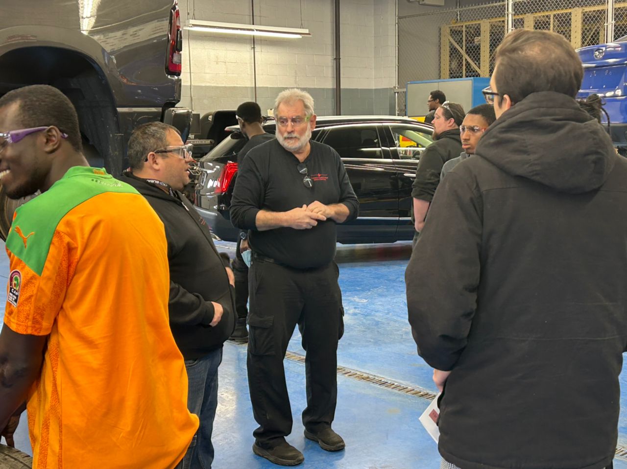 Students in auto tech class with instructor