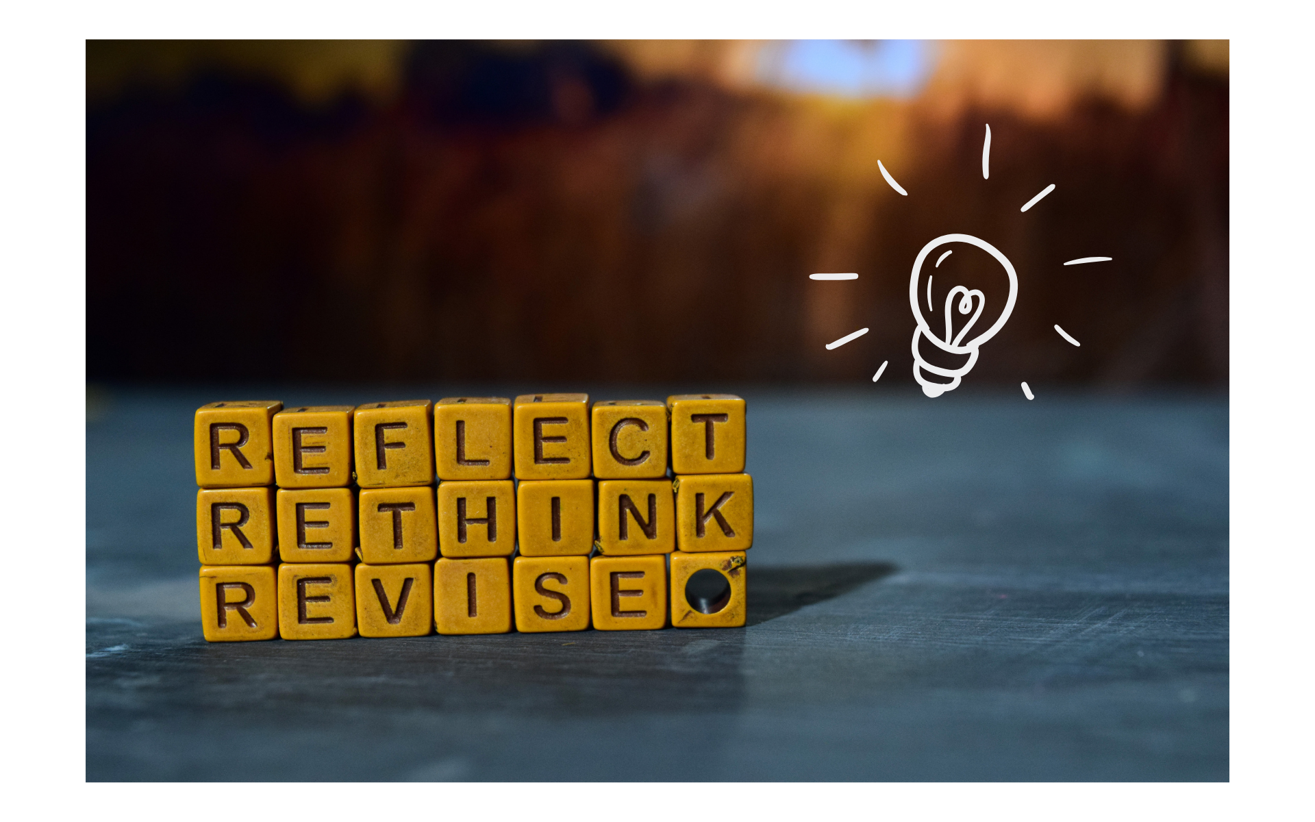 Letter blocks stacked and combined to spell out reflect, rethink, and revise. 