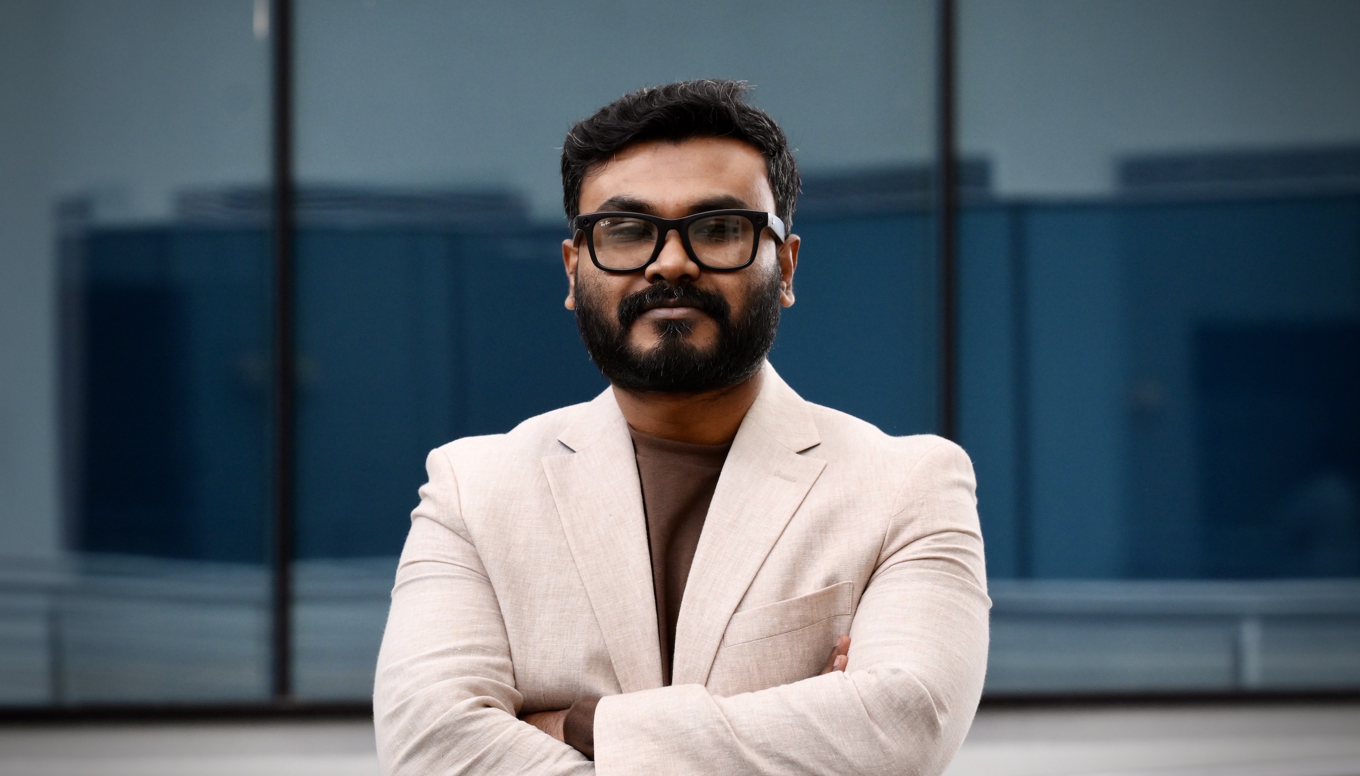 A photo of NOVA Cloud Computing professor Shahpar Islam, looking at the camera with his arms folded.